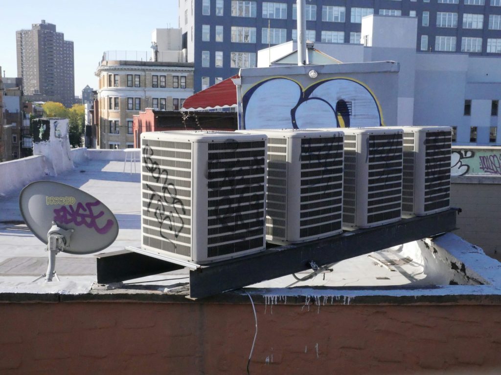 a large air conditioner sitting on top of a roof